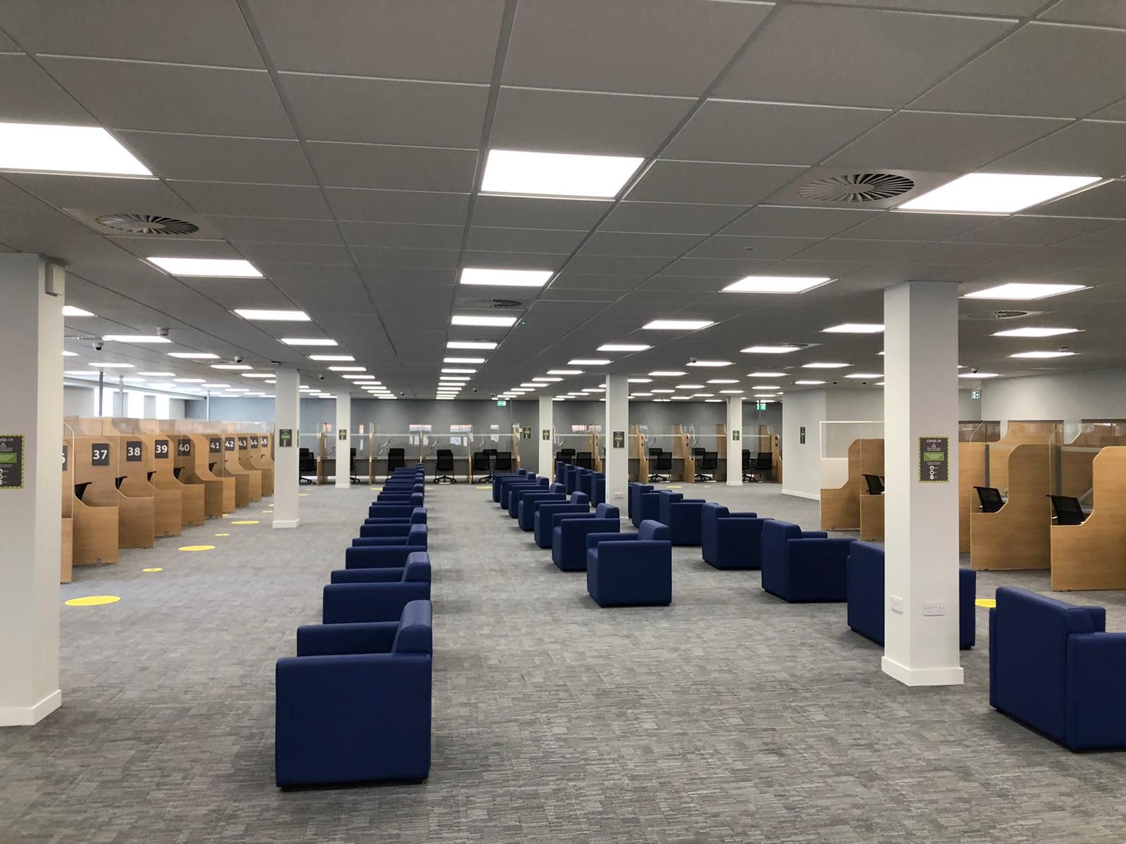 Commercial office cleaning environment showing a large open-plan workspace maintained to a high standard